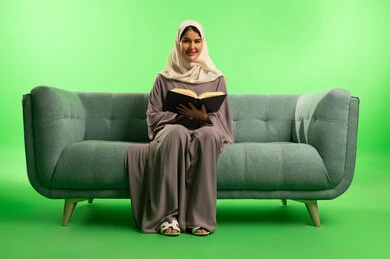 Saudi Woman Reading Book on Green Screen Background