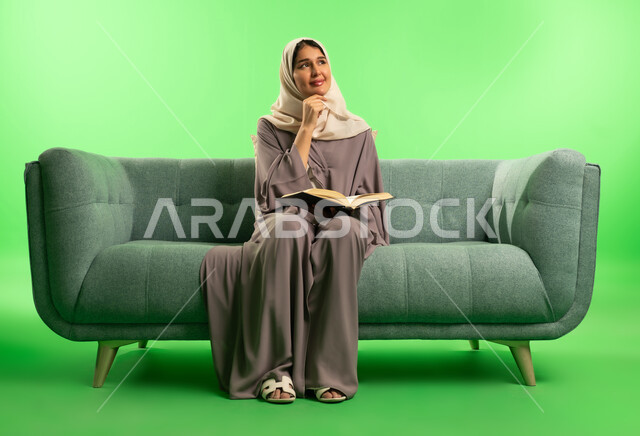 Saudi Woman Reading Book on Green Screen Background