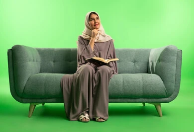 Saudi Woman Reading Book on Green Screen Background