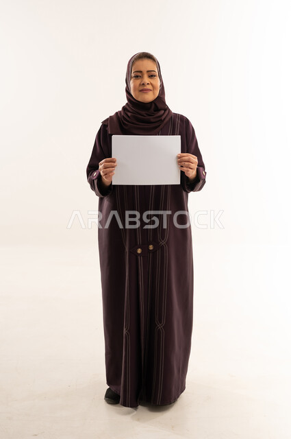 Arab Woman in Abaya Holding Blank White Sign