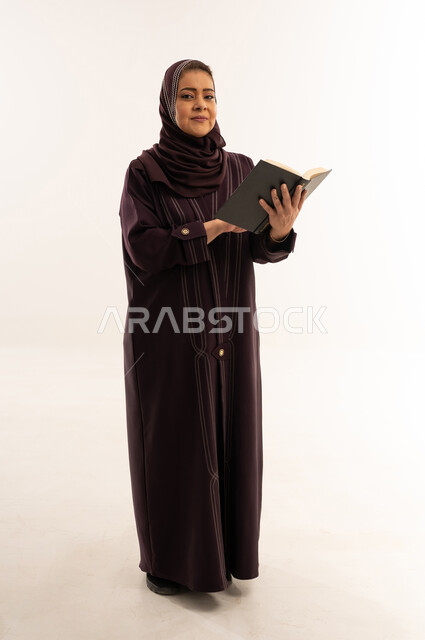 Saudi Woman in Purple Abaya Holding Book