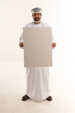 Omani Man Holding Blank White Board in Studio