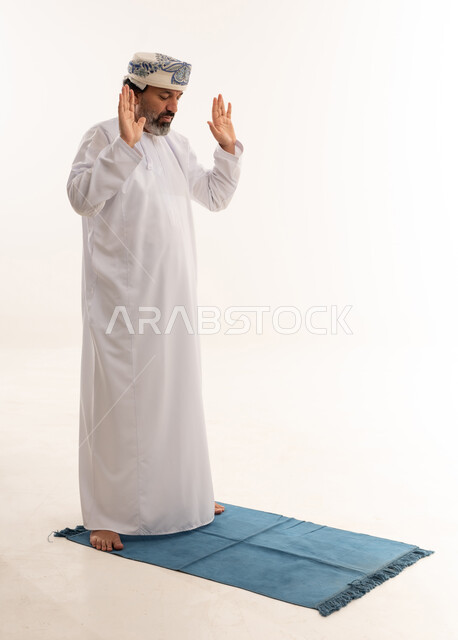 Omani Man Performing Salah on Prayer Mat