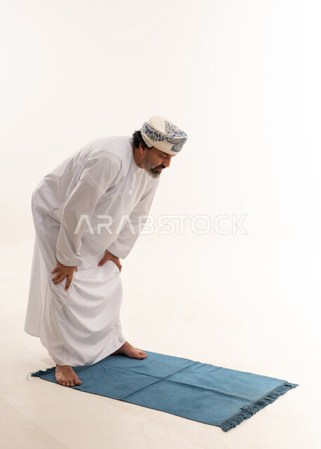 Omani Man Performing Ruku Prayer on White Background