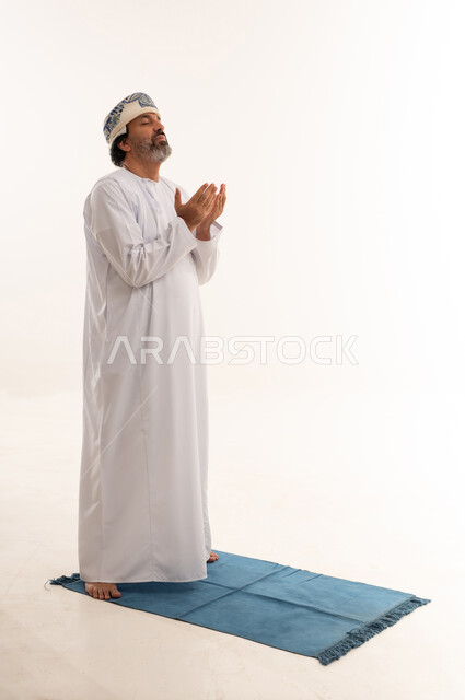 Omani Man Praying and Supplicating on White Background