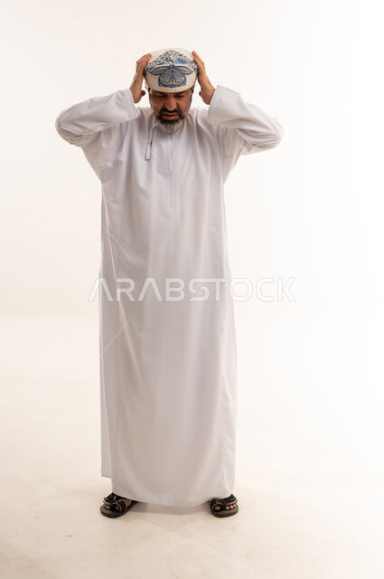 Omani Man in Traditional Dress with Headache