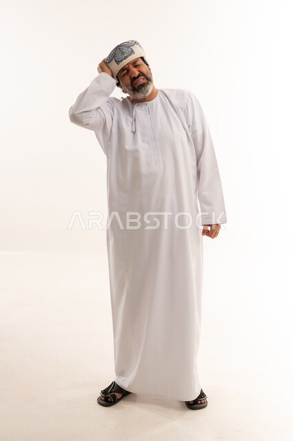 Omani Man in Traditional Dress with Headache