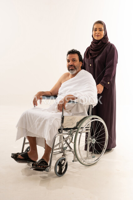 Saudi Pilgrim in Wheelchair on White Background