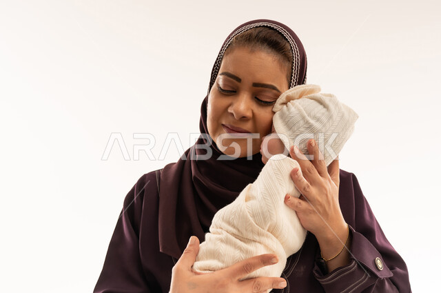 Emirati Mother Holding Newborn Baby in Studio