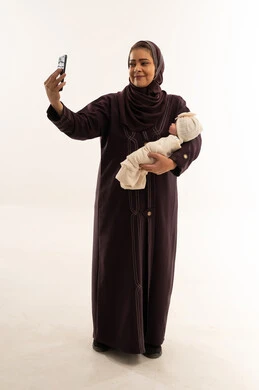 Saudi Mother with Newborn Baby Taking Selfie