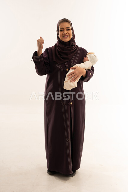 Saudi Woman in Abaya Holding Newborn Baby