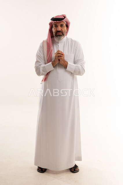 Saudi Man in Thobe Pleading on White Background