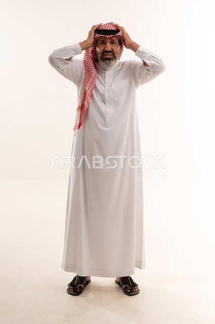 Stressed Saudi Man in Traditional Thobe Studio Shot