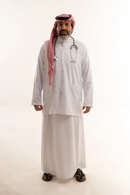 Saudi Male Doctor in Traditional Attire and Lab Coat