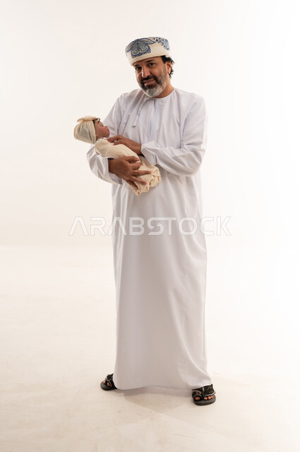 Omani Man Holding Newborn Baby on White Background