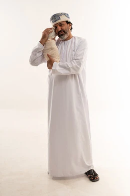 Omani Father Holding Newborn Baby in Studio