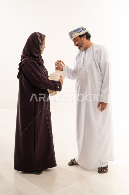 Omani Couple with Newborn Baby in Traditional Dress