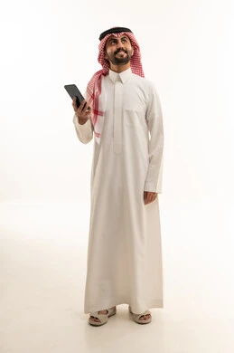 Saudi Man in Traditional Thobe Holding Smartphone