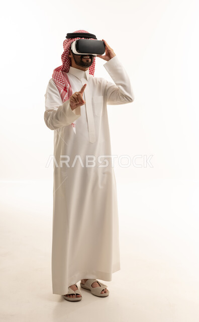 Saudi Man Using Virtual Reality Headset on White Background