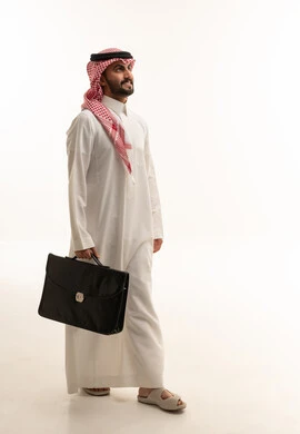 Saudi Businessman Walking with Briefcase on White Background
