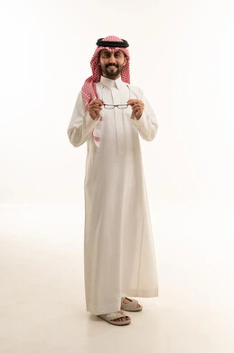 Saudi Man in Traditional Thobe Holding Eyeglasses