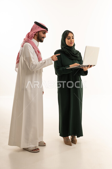 Saudi Business Couple with Laptop in White Studio