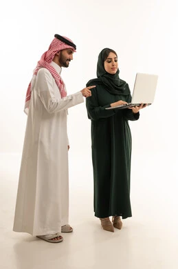 Saudi Business Couple with Laptop in White Studio