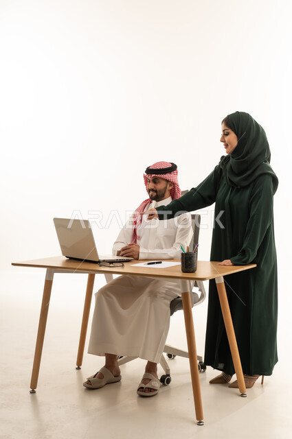 Saudi Business Colleagues Working at Laptop