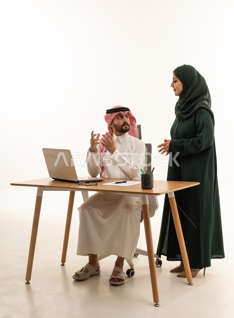Saudi Business Colleagues Discussing Work in Office