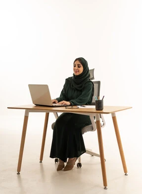Saudi Businesswoman Using Laptop on White Background