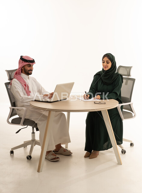 Saudi Business Couple Working in Studio Office