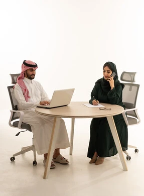 Saudi Business Couple Working in Modern Office