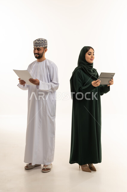 Omani Professionals with Tablet and Document in Studio