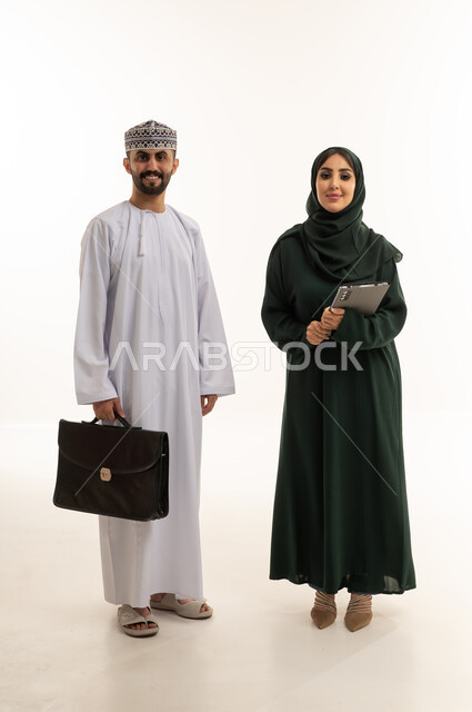 Omani Business Couple with Briefcase and Tablet