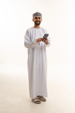 Omani Man in Traditional Dress Using Smartphone Studio