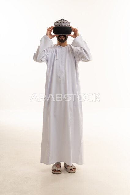Omani Man Using Virtual Reality Headset in Studio