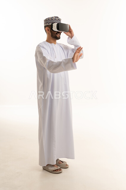 Omani Man Wearing VR Headset in Studio Shot