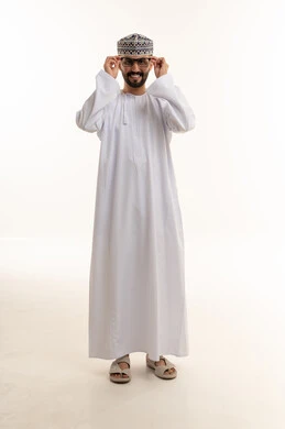 Omani Man in Traditional Dishdasha and Kuma Cap
