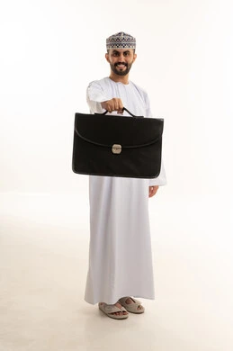Omani Businessman Holding Briefcase in White Studio