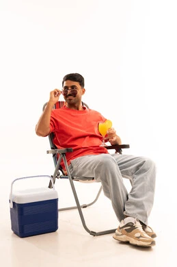 Saudi Man on Camping Chair with Cooler and Juice