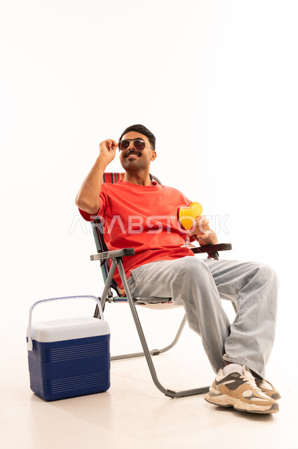 Man in Beach Chair with Cooler and Summer Drink