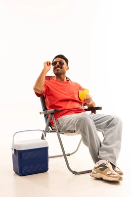 Man in Beach Chair with Cooler and Summer Drink