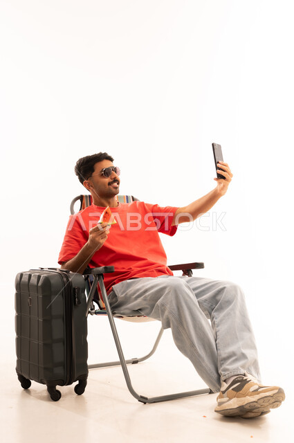 Saudi Traveler Taking Selfie with Watermelon in Studio