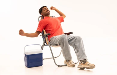 Arab Man Stretching on Camping Chair White Background