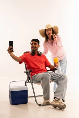 Man Taking Selfie with Woman in Summer Studio Gear