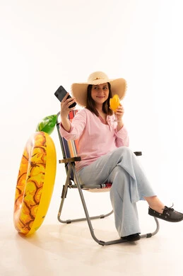 Arab Woman on Beach Chair with Smartphone and Juice