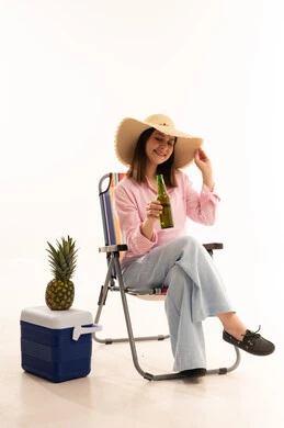 Woman with Straw Hat and Pineapple in Studio
