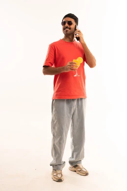 Arab Man Using Smartphone Holding Orange Juice
