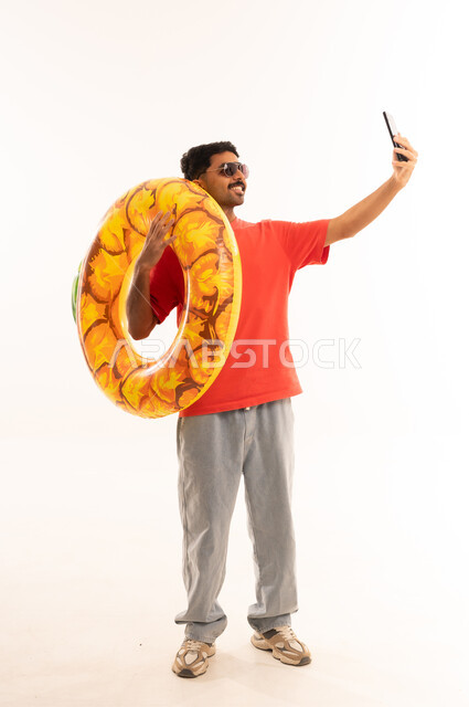 Indian Man with Swim Ring Taking Selfie