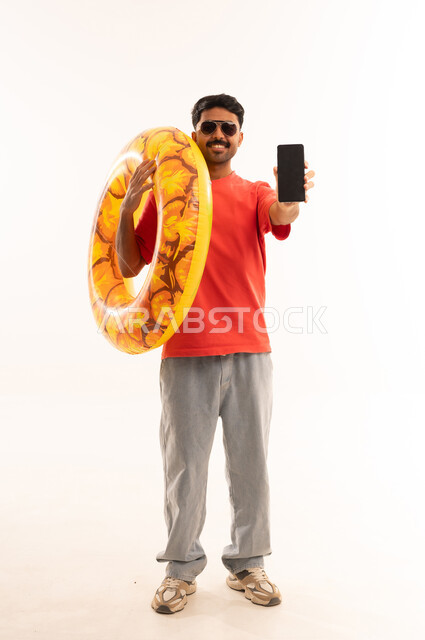 Man with Swimming Ring Holding Smartphone on White Background